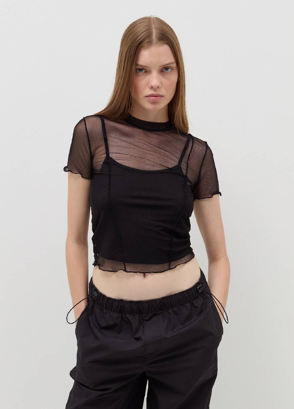 B. ANGEL T-shirt crop in mesh con profili ondulati Offerta