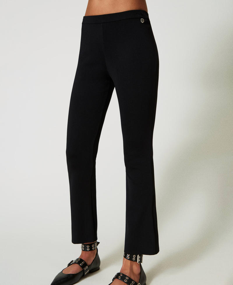 Scee by twin set Pantaloni flare in maglia Sconti questo mese