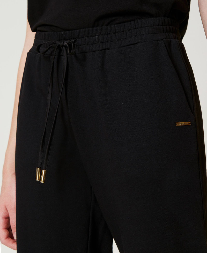 Scee by twin set Pantaloni joggers in felpa con raso Fino al 50% di sconto